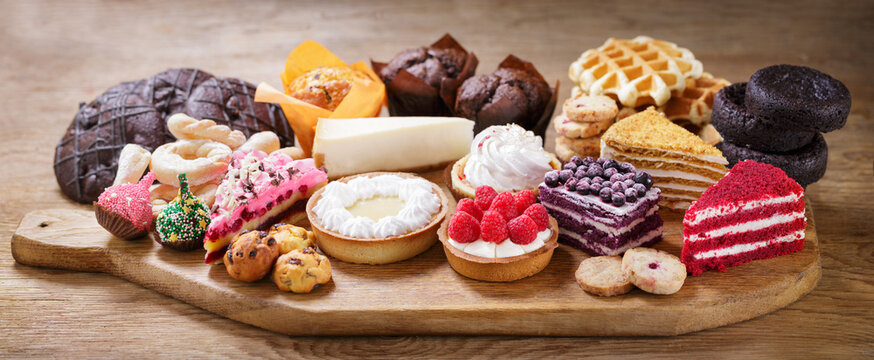 Sweet dessert. Various piece of cakes, muffins and cookies