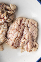 brain pork offal raw meat delicious snack mortadella, pistachios, ham healthy meal food snack diet on the table copy space food background rustic top view 