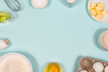 Ingredients for cookies - flour, sugar, egg, butter. Background with baking ingredients. Copy space.