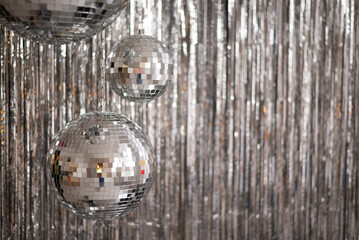 Festive background. Many disco ball on silver background. Christmas. Wedding. Birthday