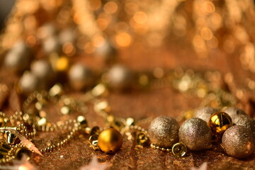 Golden shiny Christmas background. Festive wallpaper with Christmas toys