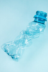 Close up of plastic stripped bottle on blue background