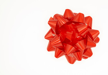 Scarlet red Christmas gift box bow on white background