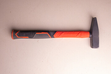 Locksmith's hammer with a plastic handle. Joiner's hand tool.