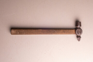 Locksmith's hammer with a wooden handle. Joiner's hand tool.