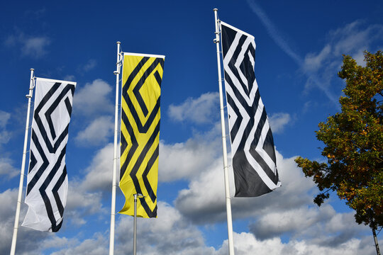 Celle, Lower Saxony, Germany - October 16, 2022: Flags at the entrance of a Renault store in Celle, Germany - Renault is a French multinational automobile manufacturer