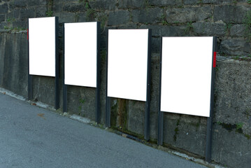 diagonally offset billboard in the city on a steep street	