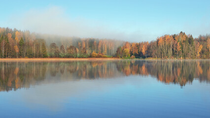Fototapeta na wymiar Fog on shores of Finnish Tuusula lake: morning, autumn, calm.