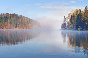 Fototapeta na wymiar Fog on shores of Finnish Tuusula lake: morning, autumn, calm.