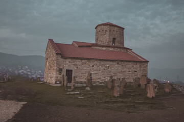 Church of the Holy Apostles Peter and Paul close to Novi Pazar, Serbia in evening hours and spooky atmosphere.