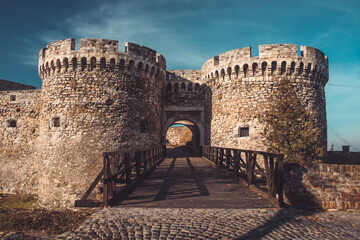 Entrance to famous Kalemegdan fortress over belgrade in autumn sun. Majestic fortress with wooden...