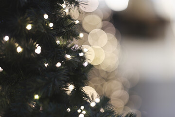 Christmas tree indoor, lights bokeh around, Christmas atmosphere, Christmas holidays banner