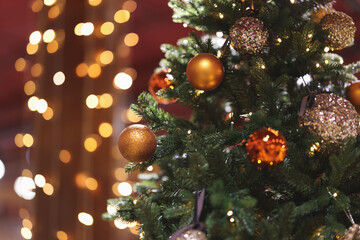 Obraz na płótnie Canvas Christmas tree indoor, lights bokeh around, Christmas atmosphere, Christmas holidays banner