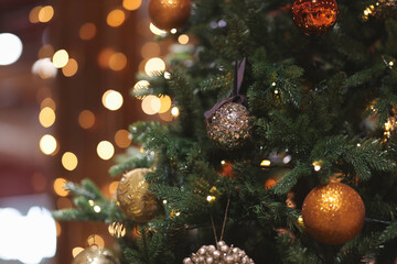 Obraz na płótnie Canvas Christmas tree indoor, lights bokeh around, Christmas atmosphere, Christmas holidays banner