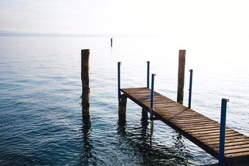 Fototapeta premium wooden dock in the lake area on a frosty winter morning