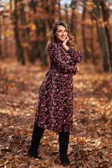 Size plus woman in a forest in the autumn