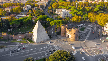 Aerial view of Ostiense square and Pyramid of Cestius, a Roman Era pyramid located in Rome, Italy.