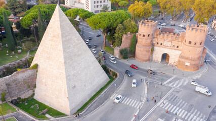 Aerial view of Ostiense square and Pyramid of Cestius, a Roman Era pyramid located in Rome, Italy.