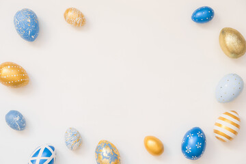 Fototapeta na wymiar Frame of Easter decorated eggs isolated on white background. Minimal easter concept. Happy Easter card with copy space for text. Top view, flatlay.