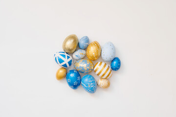 Blue Easter decorated eggs isolated on white background. Minimal easter concept. Happy Easter card with copy space for text. Top view, flatlay.