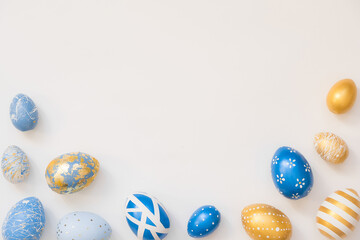 Frame of Easter decorated eggs isolated on white background. Minimal easter concept. Happy Easter card with copy space for text. Top view, flatlay.