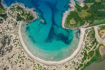Fototapeta premium Aerial drone photo of the iconic semicircular sandy beach of Voidokoilia in Messinia, Gialova, Peloponnese, Greece