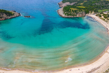 Fototapeta na wymiar Aerial drone photo of the iconic semicircular sandy beach of Voidokoilia in Messinia, Gialova, Peloponnese, Greece
