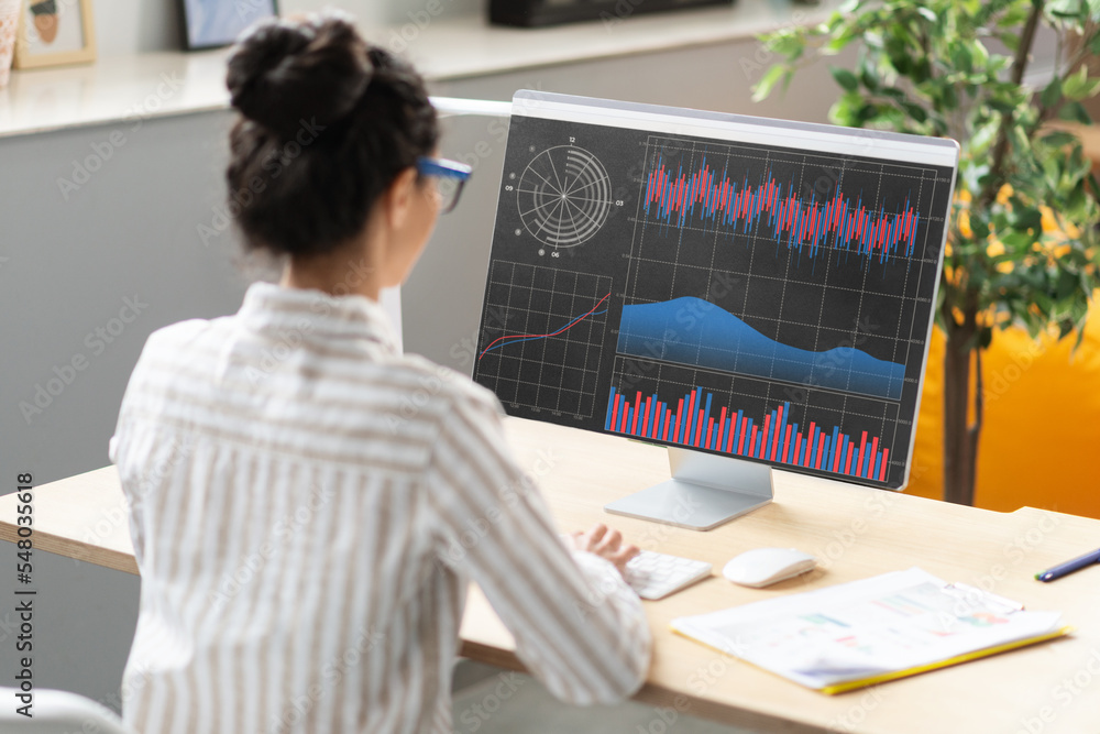 Poster young businesswoman analyzing statistics on computer screen, working with financial graphs and chart
