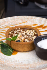 Apple tart with apricot gel and ice cream. French traditional dessert. Sweetness.