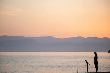 silhouette of a person on a sunset