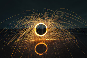 Turning steel wool on fire in the air above the water