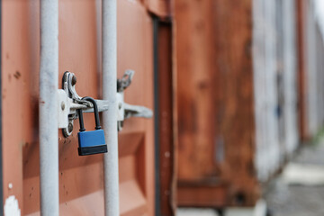 Close up of lock on door of cargo container in docks, copy space
