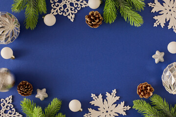 Christmas tree decorations concept. Flat lay composition of silver christmas baubles, snowflakes,...