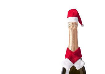 Champagne bottle wearing christmas hat and red knitting scarf on white background. New Year concept
