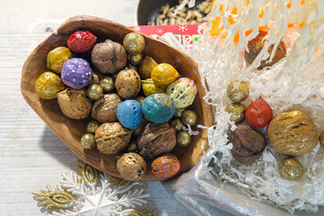 Holiday Christmas decoration still life with colorful walnuts, selective focus