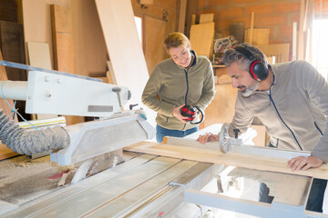 carpenter with apprentice in training period