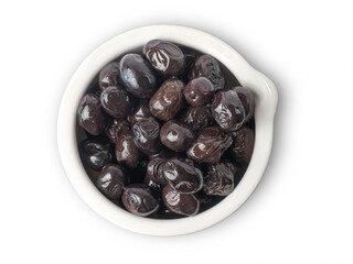 black olives in a white porcelain bowl, top view