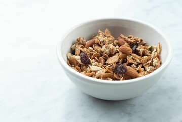 Closeup shot of a bowl of healthy cereal with nuts and oats