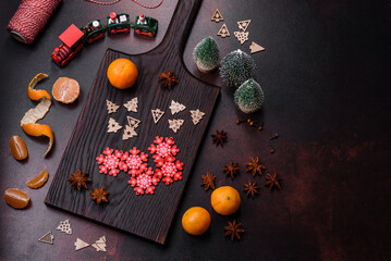 Beautiful Christmas decorations with holiday toys, clementines and gingerbread