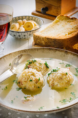 Speck dumplings cooked in vegetable broth. Typical Tyrolean dish.