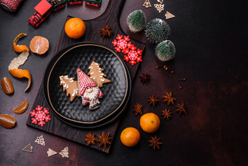 Beautiful Christmas decorations with holiday toys, clementines and gingerbread