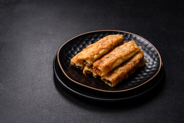 Fresh bite rolls from leaves of cabbage with minced meat, onions and carrots