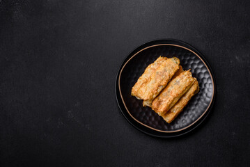 Fresh bite rolls from leaves of cabbage with minced meat, onions and carrots