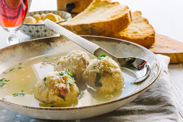 Speck dumplings cooked in vegetable broth. Typical Tyrolean dish.