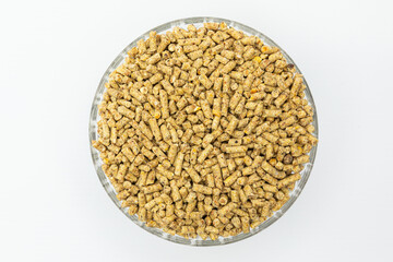 Fraction of feed additives for animals on a white background in a bowl
