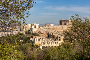 Fototapeta na wymiar Historic Landmark, Odeon of Herodes Atticus, in the Acropolis of Athens, Greece. Sunny Day viewed from Philopappos Hill.