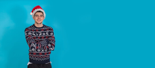 young man with christmas clothes and santa claus hat isolated