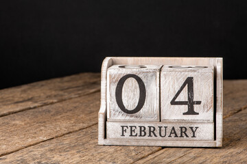 Day 4 of february month, Wooden calendar with date. Empty space for text.