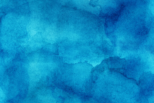 Hand painted blue watercolor background.