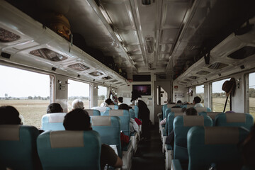People sitting on a train in Asia